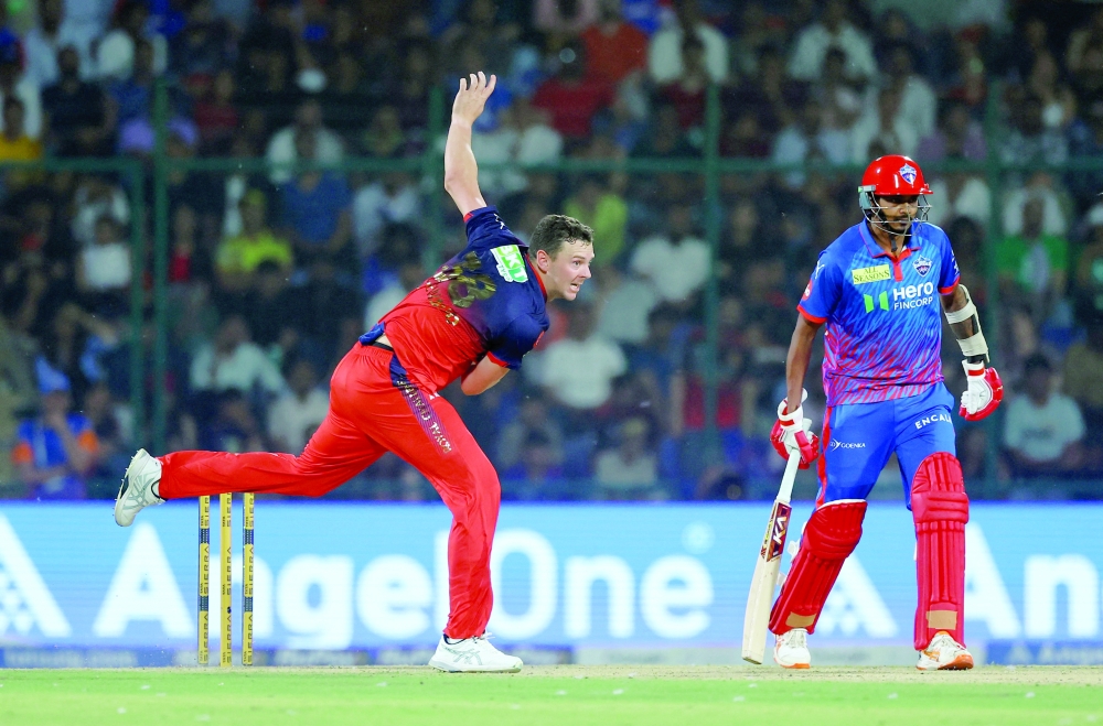 Royal Challengers Bengaluru's Josh Hazlewood in action against Delhi Capitals in New Delhi. — Reuters