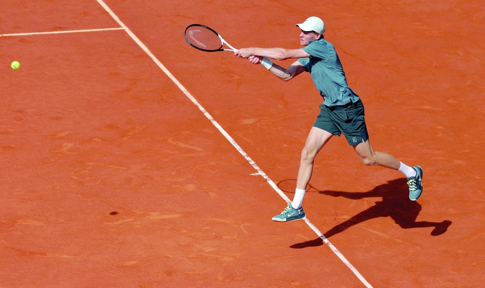 Italy's Jannik Sinner returns the ball to Britain's Cameron Norrie during their 2026 ATP Tour Madrid Open tennis tournament singles match at the Caja Magica in Madrid, on April 28, 2026. (Photo by Thomas COEX / AFP)
