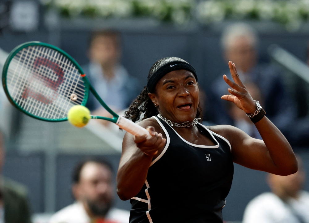 US' Hailey Baptiste returns the ball to Belarus' Aryna Sabalenka during their 2026 WTA Tour Madrid Open tennis tournament singles match 