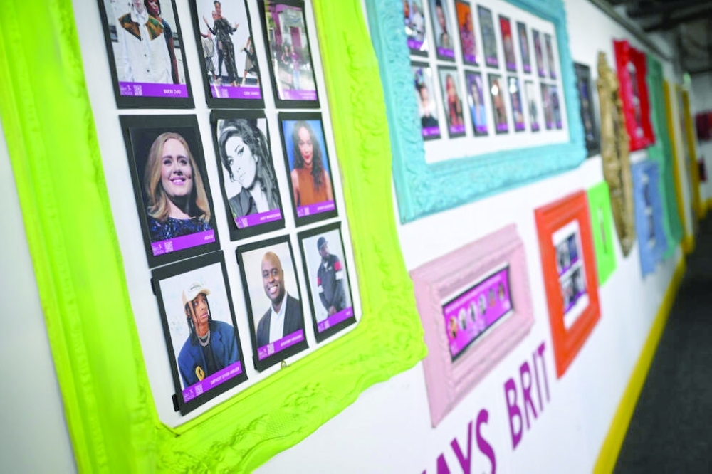 The BRIT wall of fame, featuring British singers Adele and Amy Winehouse— AFP