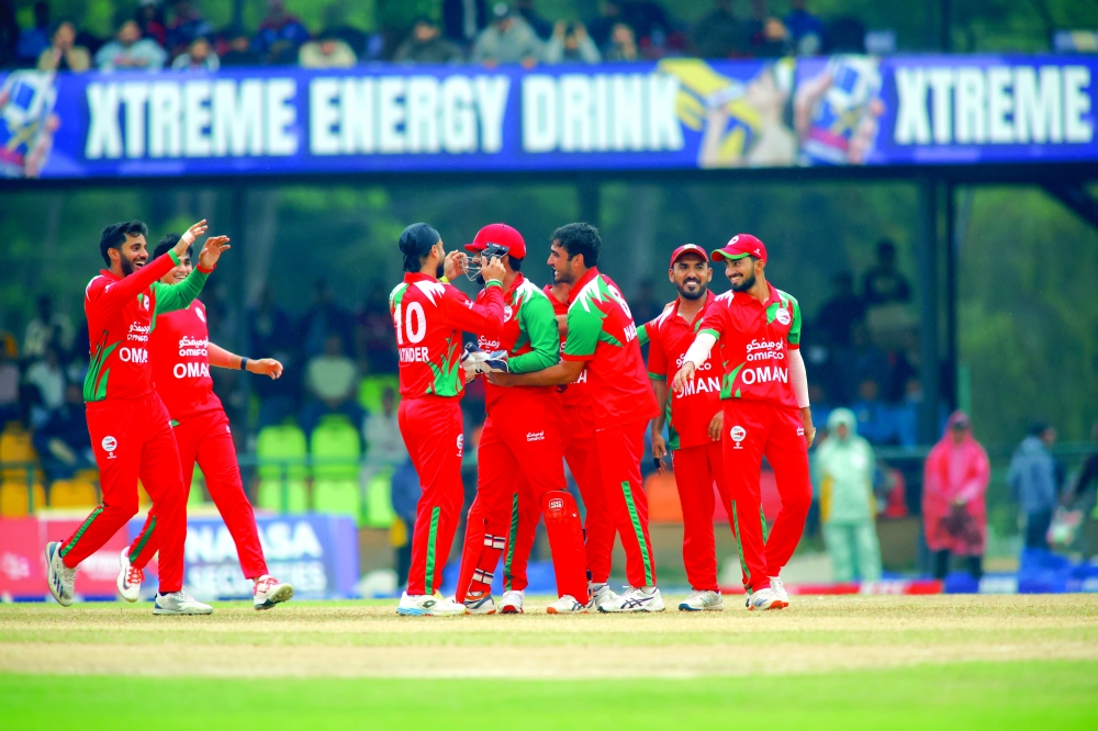 Oman celebrating the wicket of Rohit Paudel