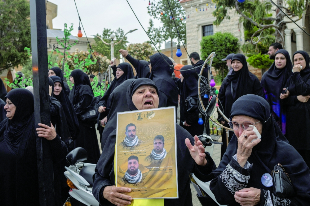 FILE PHOTO: Mourners attend a funeral ceremony of four Hezbollah fighters and two civilians, amid a temporary ceasefire between Lebanon and Israel, in the village of Maaroub, southern Lebanon. — Reuters