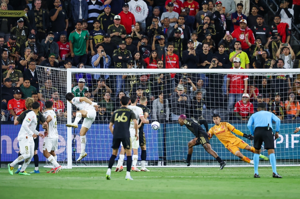  LAFC defender Nkosi Tafari (91) headers the ball into the goal for a match winning goal against Toluca  