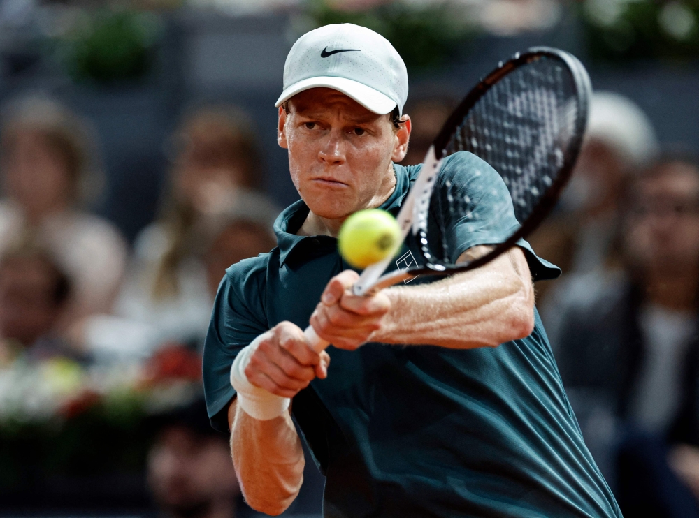 Italy's Jannik Sinner returns a ball to Spain's Rafael Jodar during their 2026 ATP Tour Madrid Open tennis tournament quarterfinal singles match at the Caja Magica in Madrid 
