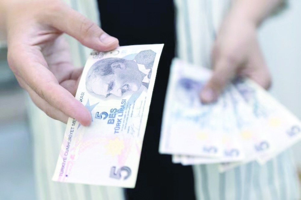 EM stocks, FX fall on renewed Iran war risks, but set for monthly gains