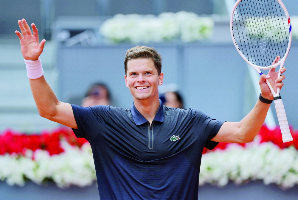 Belgium's Alexander Blockx celebrates beating Norway's Casper Ruud during their 2026 ATP Tour Madrid Open tennis tournament quarter-final singles match at the Caja Magica in Madrid, on April 30, 2026. (Photo by Thomas COEX / AFP)
