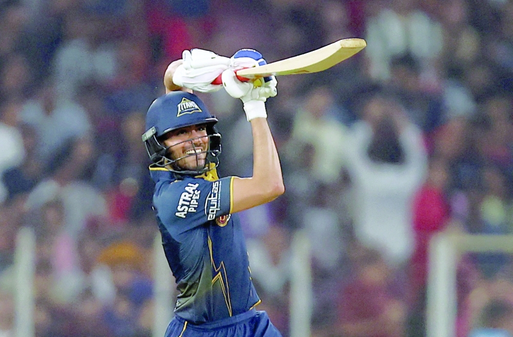 Gujarat Titans' Shubman Gill in action against Royal Challengers Bengaluru at Ahmedabad. — Reuters