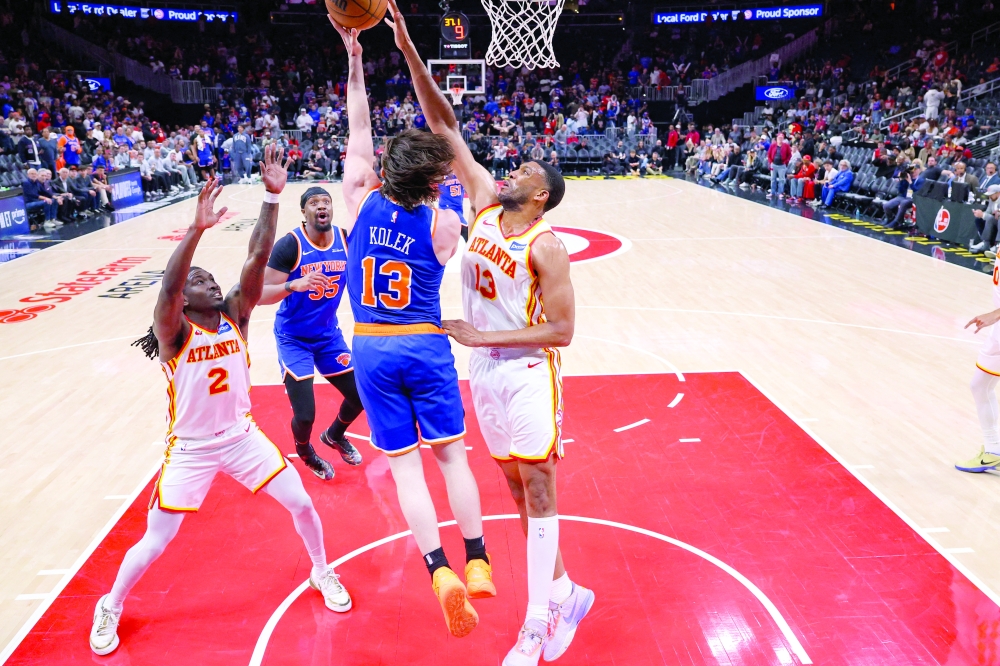 Atlanta Hawks center Tony Bradley (13) blocks the shot of New York Knicks guard Tyler Kolek (13) in the second half during game six of the first round of the 2026 NBA Playoffs at State Farm Arena. — Imagn Images
