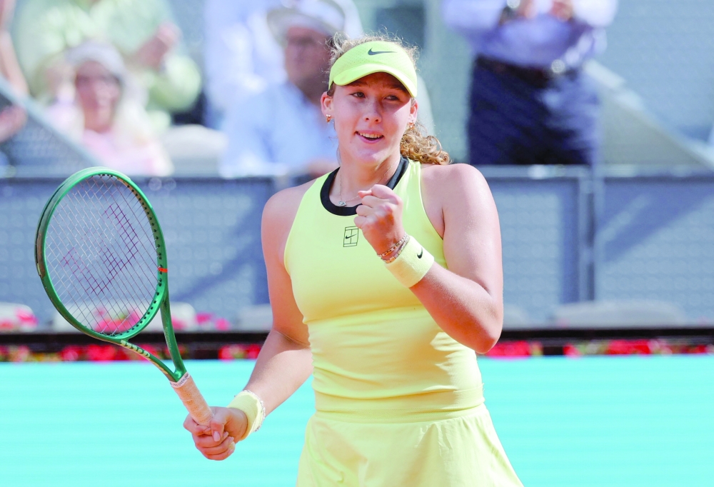 Russia's Mirra Andreeva celebrates winning her 2026 WTA Tour Madrid Open tennis tournament women's semi-final singles match against USA's Hailey Baptiste at the Caja Magica in Madrid, on April 30, 2026. Andreeva won 6-4 7-6. (Photo by Thomas COEX / AFP)
