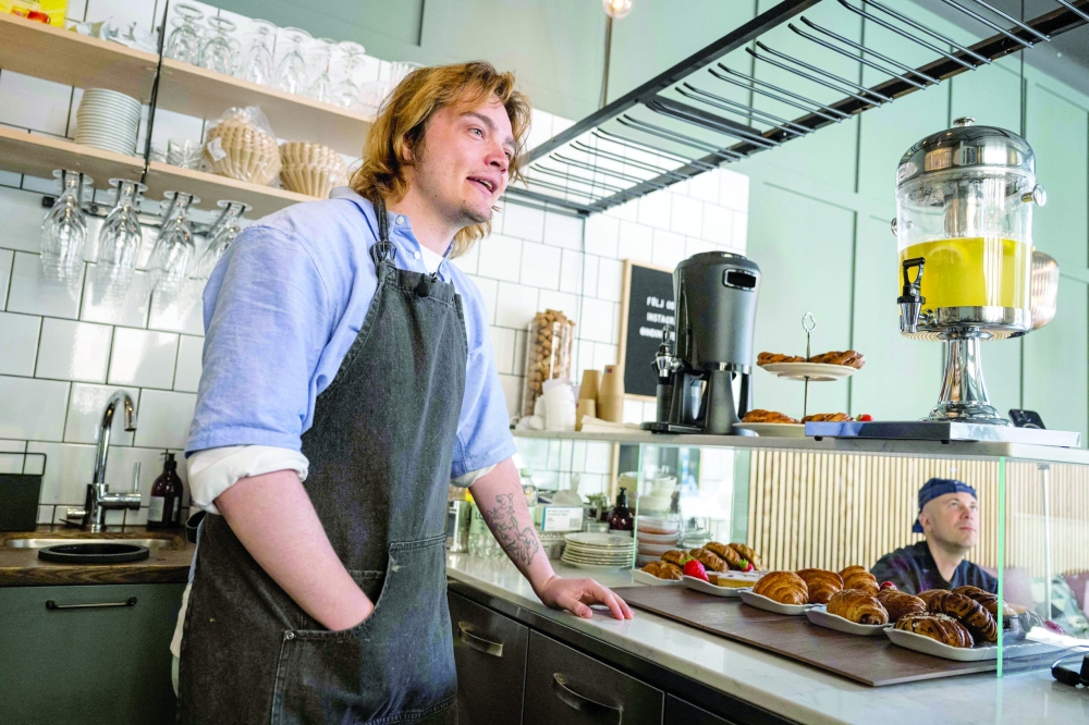 Barista Kajetan Grzelczak is pictured at the Andon Café in Stockholm. — AFP