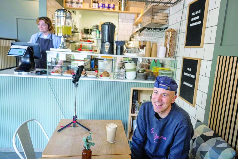 Andreu Vizquerra, a 42-year-old tourist from Spain, at the Andon Café in Stockholm. — AFP