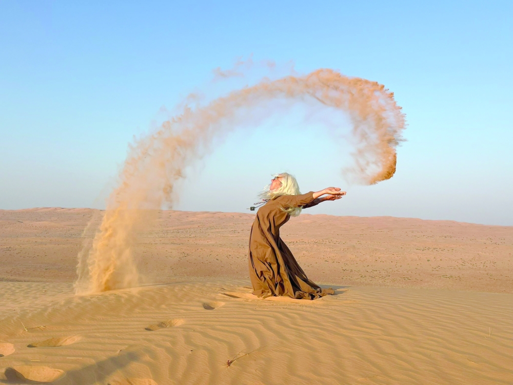 Marianne enjoys the desert, splashing across the dunes