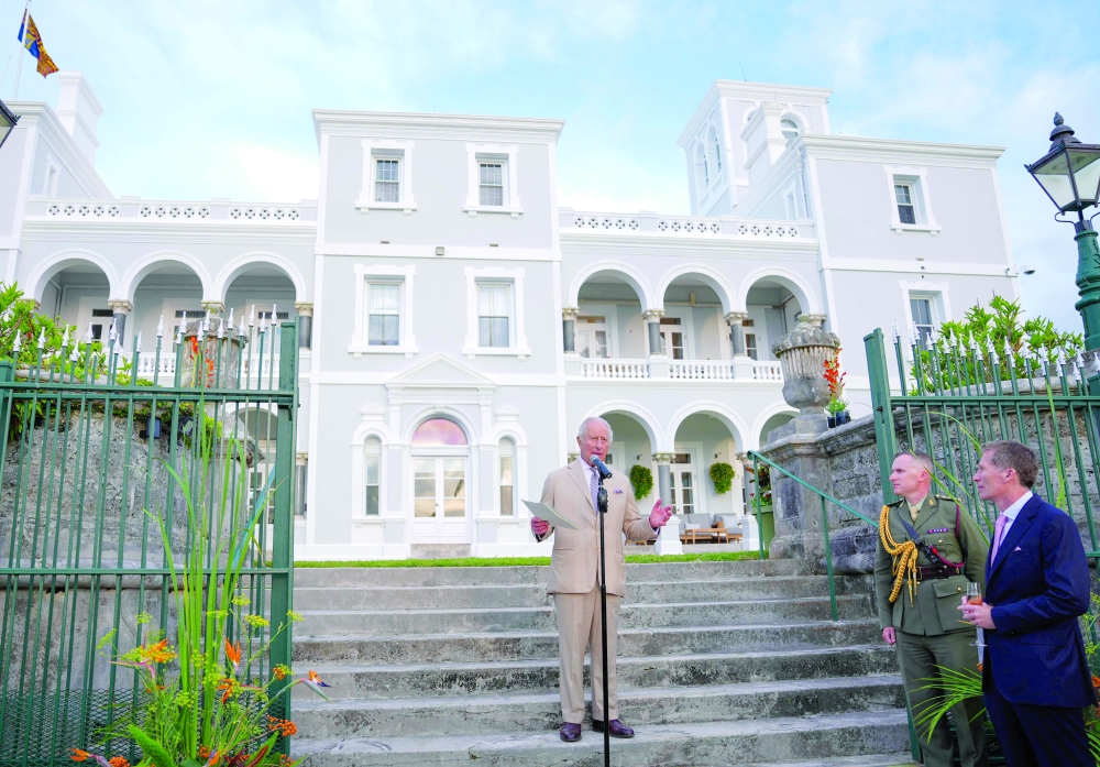 Britain's King Charles III delivers remarks during a garden party at the Government House in Hamilton, Bermuda. — AFP