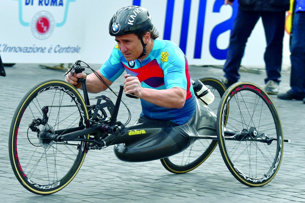 Former racing driver and paracyclist, Italian Alex Zanardi takes part in the 23rd Marathon of Rome on April 2, 2017.  — AFP