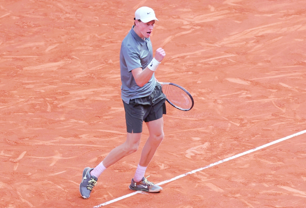 Italy's Jannik Sinner celebrates beating France's Arthur Fils during their 2026 ATP Tour Madrid Open tennis tournament semi-final singles match at the Caja Magica in Madrid, on May 1, 2026. (Photo by Thomas COEX / AFP)
