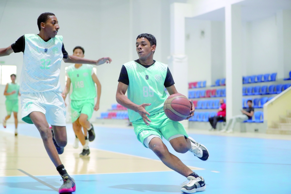 Nizwa and Al Amerat players battle for possession during their Athletes’ Development Centres Basketball League match in Muscat. — Ammar al Musafir
