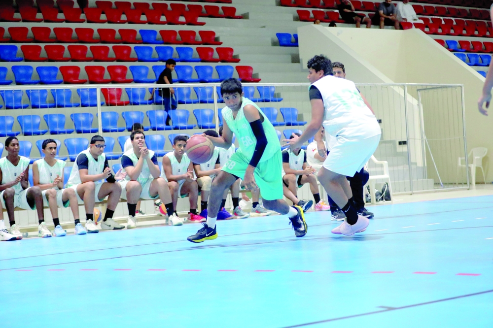 Nizwa and Al Amerat players in action at the Sultan Qaboos Sports Complex in Muscat. — Ammar al Musafir