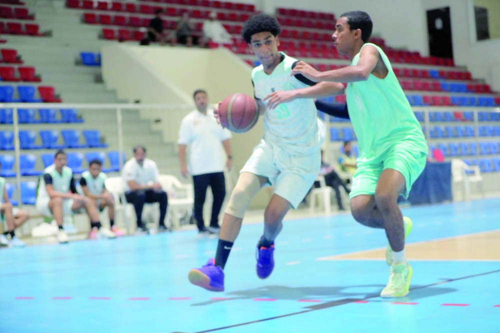 Nizwa and Al Amerat players in action at the Sultan Qaboos Sports Complex in Muscat. — Ammar al Musafir