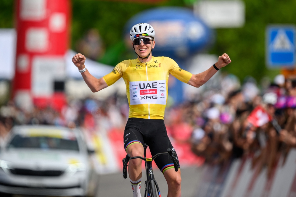  XRG's Slovenian rider Tadej Pogacar celebrates as he crosses the finish line wining the fourth stage of the Tour of Romandie UCI cycling World tour, 149.6 km from Broc and to Charmey, in Charmey, 
