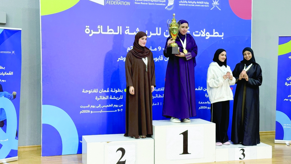 Winners of the Omani Women’s Badminton Championship pose with officials in the closing ceremony.