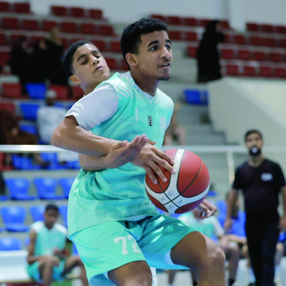 Players compete during the fourth round of the Athletes’ Development Centres Basketball League at the Sultan Qaboos Sports Complex in Muscat. — Ammar al Musafir

