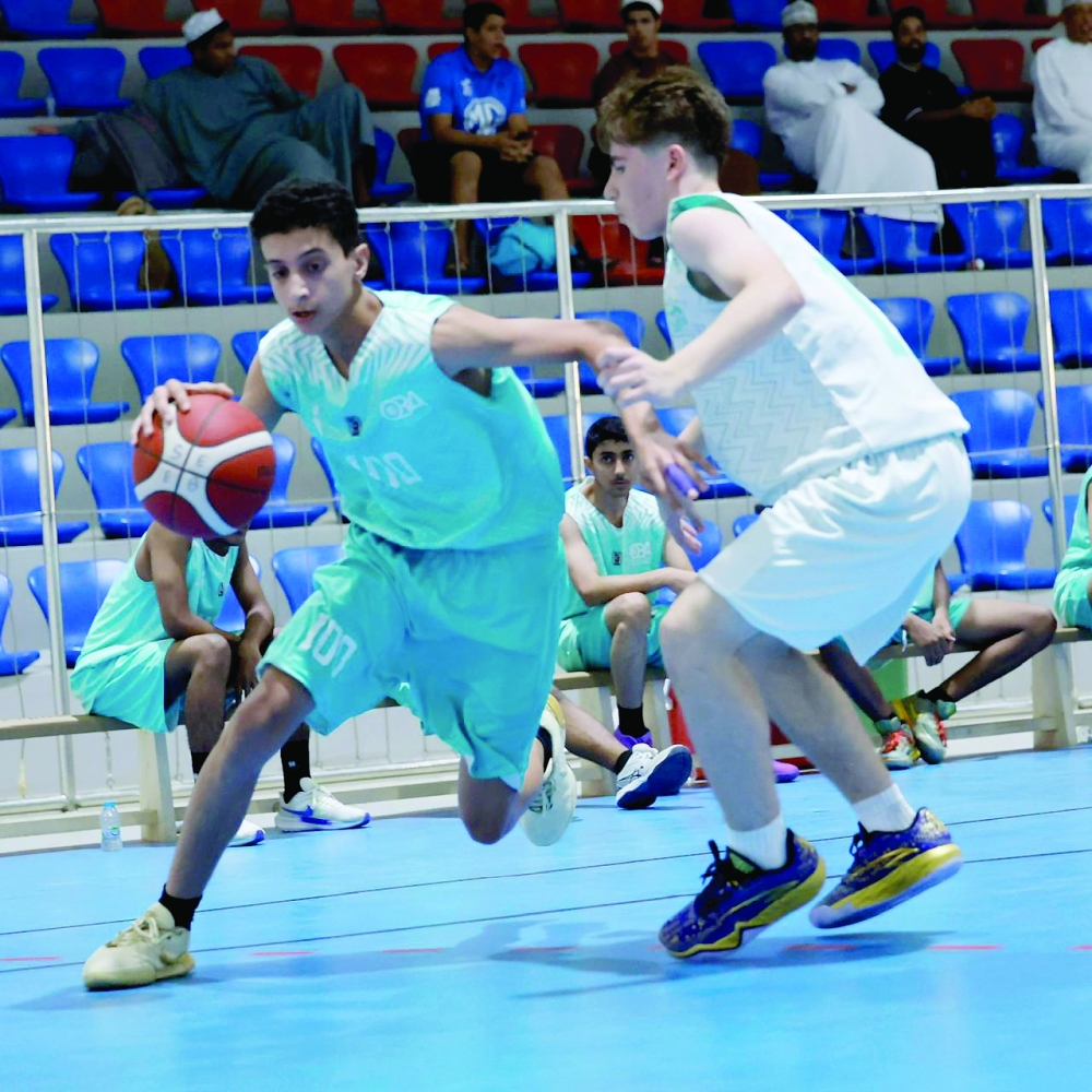 Players compete during the fourth round of the Athletes’ Development Centres Basketball League at the Sultan Qaboos Sports Complex in Muscat. — Ammar al Musafir

