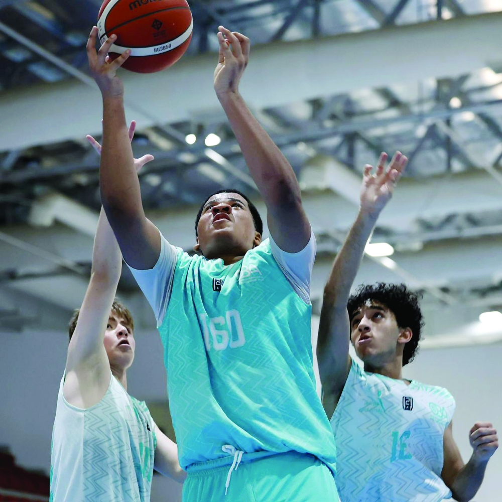 Players compete during the fourth round of the Athletes’ Development Centres Basketball League at the Sultan Qaboos Sports Complex in Muscat. — Ammar al Musafir