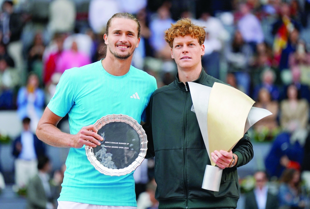 Italy's Jannik Sinner celebrates with the Madrid Open trophy after winning the men's final with runner-up Germany's Alexander Zverev. — REUTERS