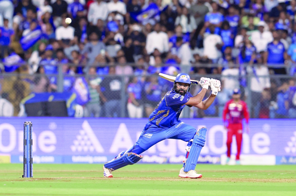 Mumbai Indians' Rohit Sharma plays a shot against Lucknow Super Giants. — Reuters