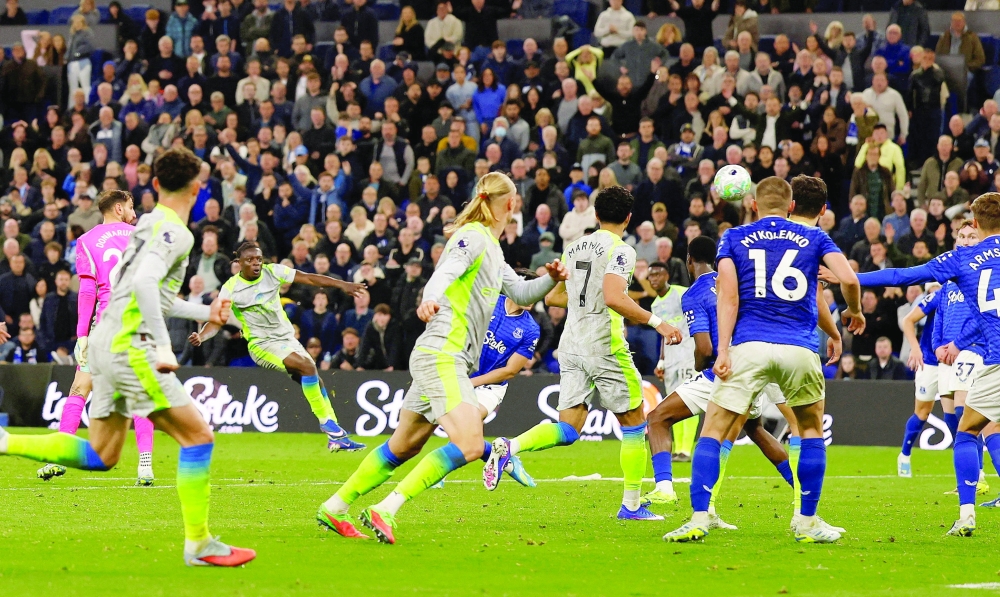 Manchester City's Jeremy Doku scores their third goal against Everton. — Reuters