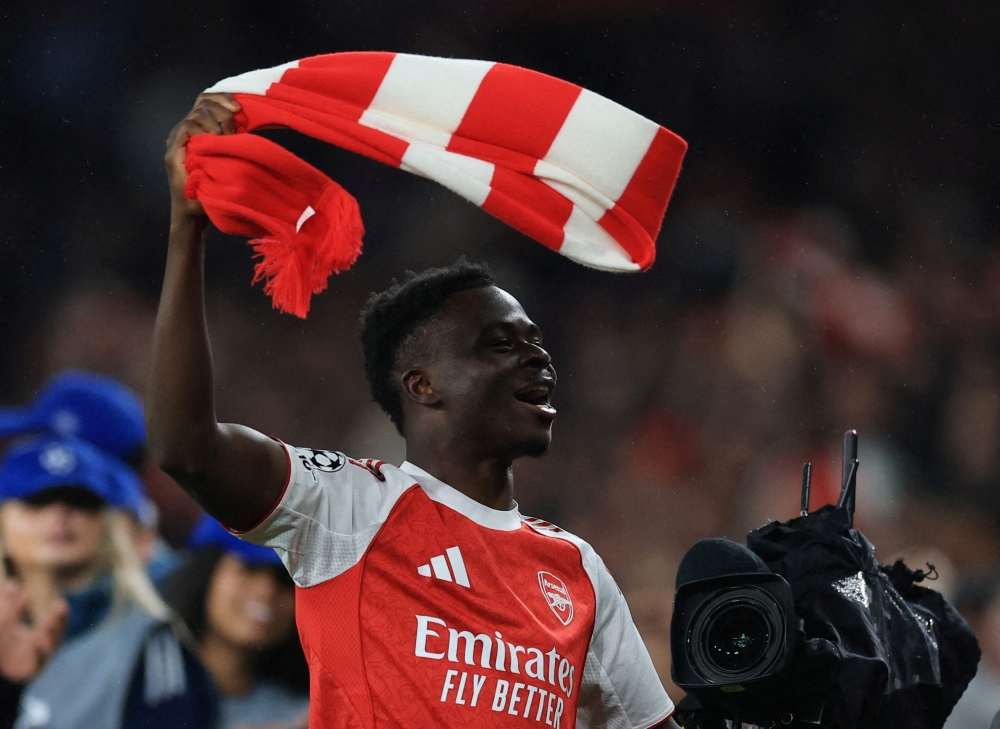 
Arsenal's Bukayo Saka celebrates after reaching the UEFA Champions League final  