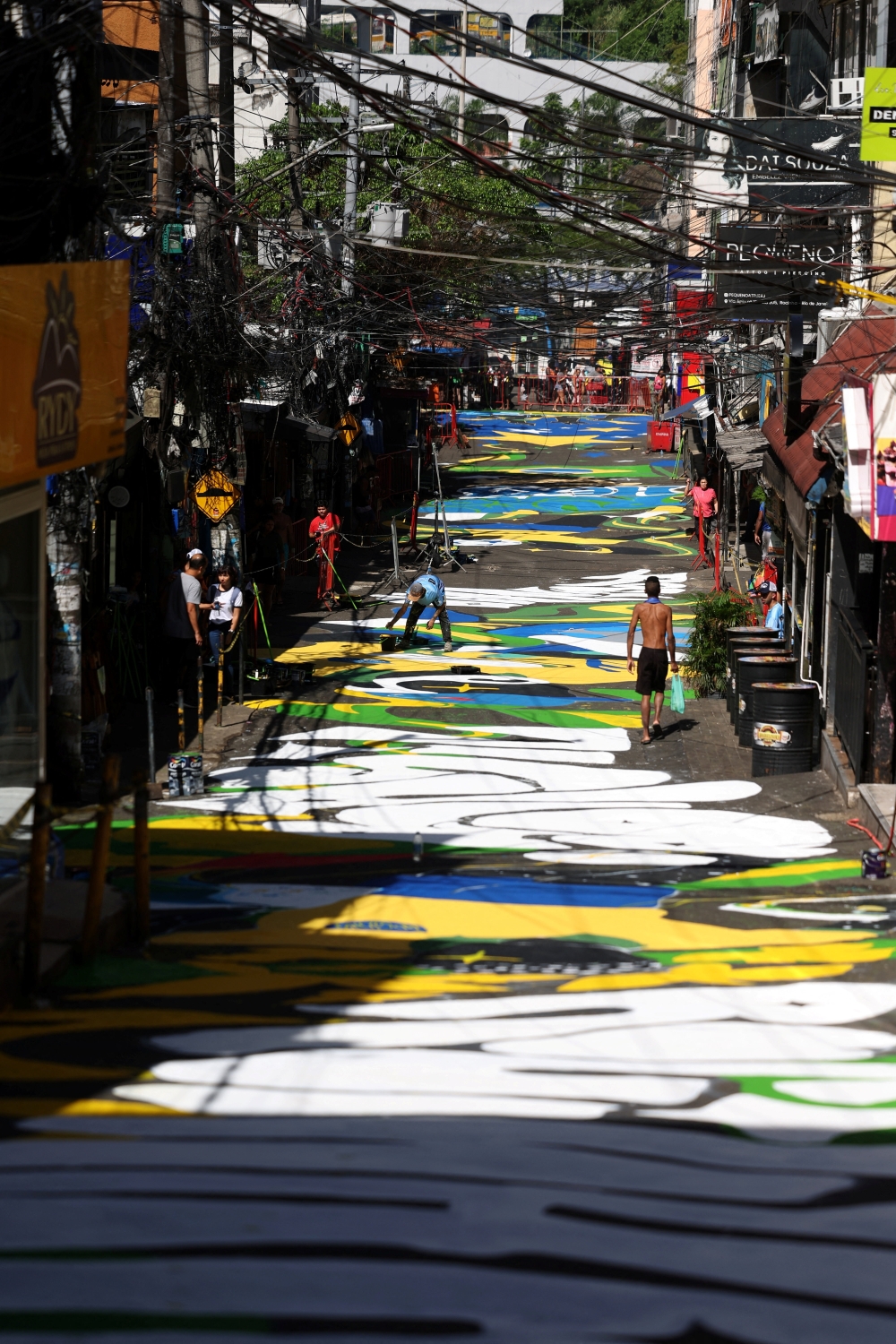 Residents walk past World Cup-themed graffiti on a street in Rocinha favela, ahead of the 2026 FIFA World Cup, in Rio de Janeiro