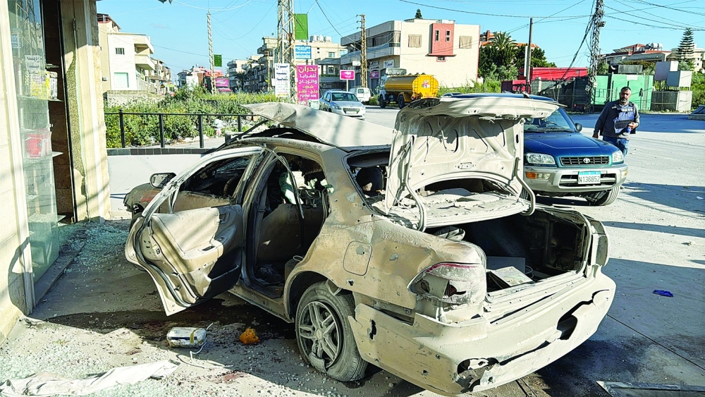A damaged car following an Israeli strike in Saksakiyeh, Lebanon. — Reuters 