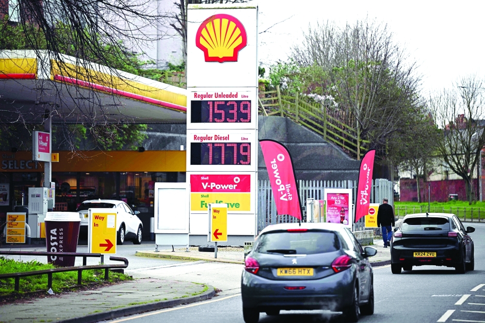 The price per litre of unleaded petrol and diesel fuels is pictured outside a Shell petrol station in Birkenhead, north-west England. British energy giant Shell announced on May 7, 2026 a 19-percent increase in net profits for the first quarter as the Middle East war sent oil and gas prices soaring in volatile trading.  AFP