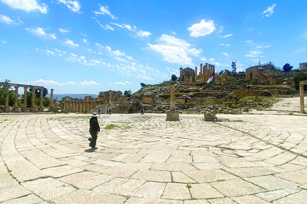 A visitor walks at the oval plaza at the ancient Roman ruins of Jerash in northern Jordan. - AFP
