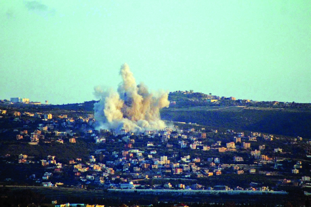 This photograph taken from the southern Lebanese area of Tyre shows smoke as it rises from the site of an Israeli airstrike that targeted the village Majdelzoun on May 6, 2026.  An Israeli strike in Lebanon's eastern Bekaa valley killed four people on May 6, while the Israeli army said it struck Hezbollah targets in the south, after warning residents of a dozen towns to evacuate. Israel and Hezbollah have been trading accusations of violating the ceasefire agreement in force since April 17.
