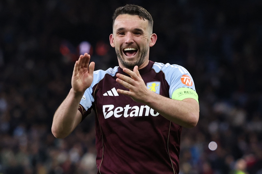 Aston Villa's Scottish midfielder #07 John McGinn celebrates 
