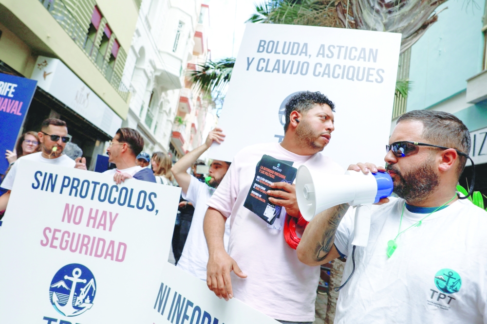 Demonstrators with placards attend a protest over lack of information ahead of the arrival of the MV Hondius, in Santa Cruz de Tenerife, Spain. — Reuters