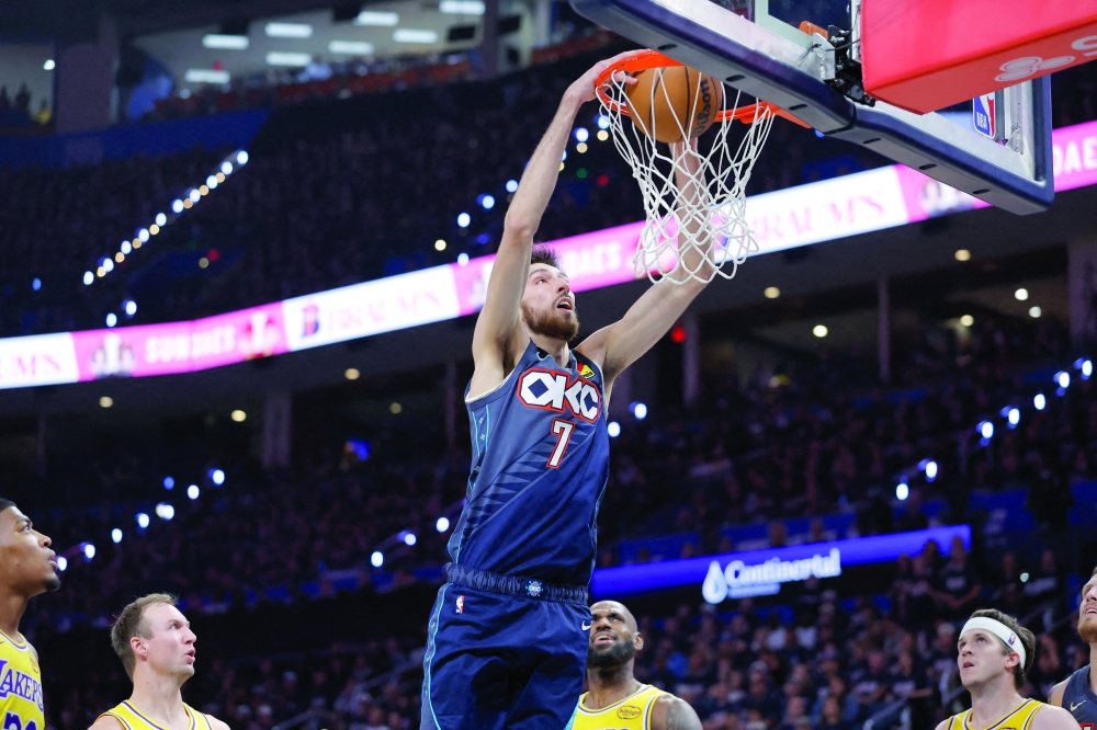 Oklahoma City Thunder's Chet Holmgren (7) dunks against the Los Angeles Lakers during game two of the second round of the 2026 NBA Playoffs at Paycom Center. — Imagn Images