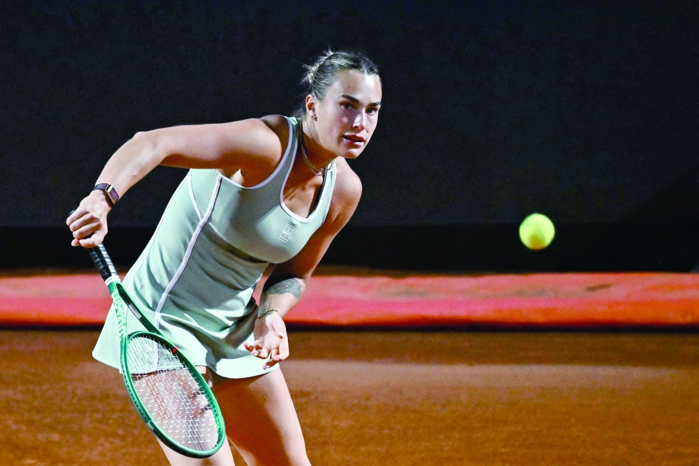 Belarus' Aryna Sabalenka plays a backhand return to Czech Republic's Barbora Krejcikova during their women's singles match of the WTA Rome Open tennis tournament at the Foro Italico in Rome on May 7, 2026.  (Photo by Filippo MONTEFORTE / AFP)
