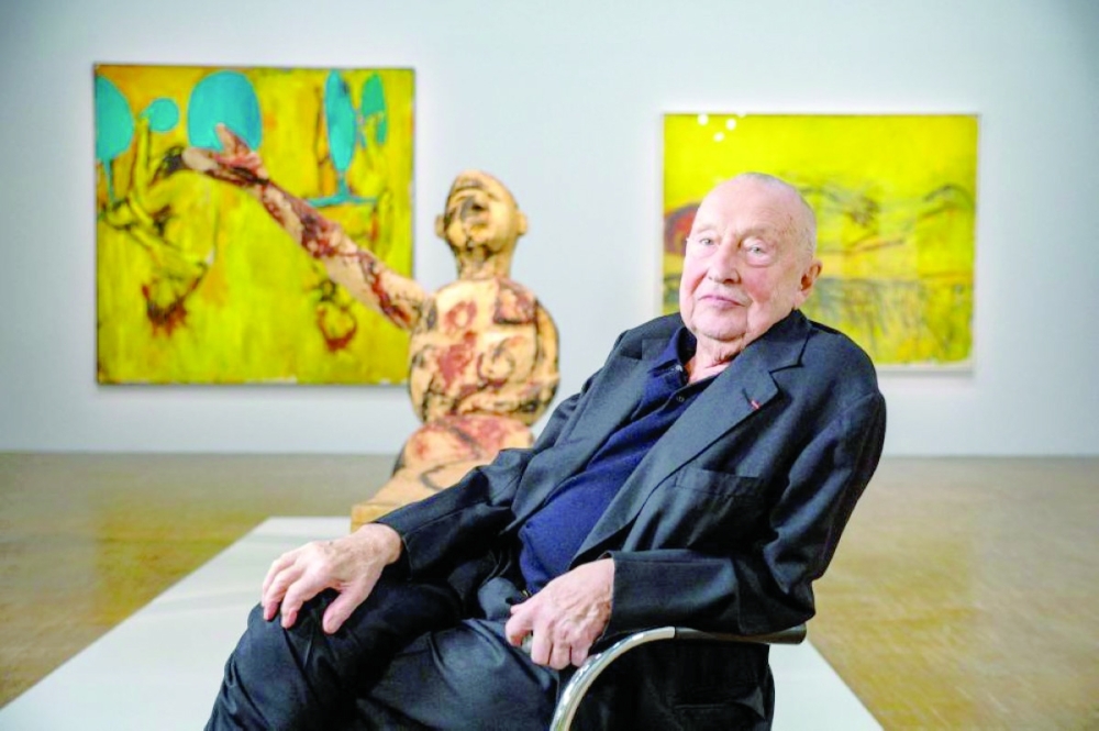 German artist Georg Baselitz poses near some of his artworks displayed at the National Museum of Modern Art. — AFP