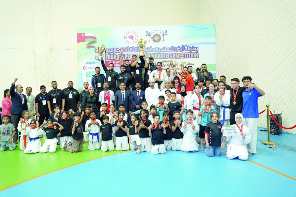 The winners in various sections celebrate with officials and guests.