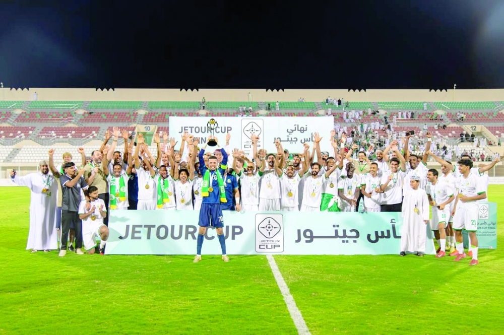 Sohar players celebrate with the Jetour Cup trophy after their 1-0 win over Al Nahda.