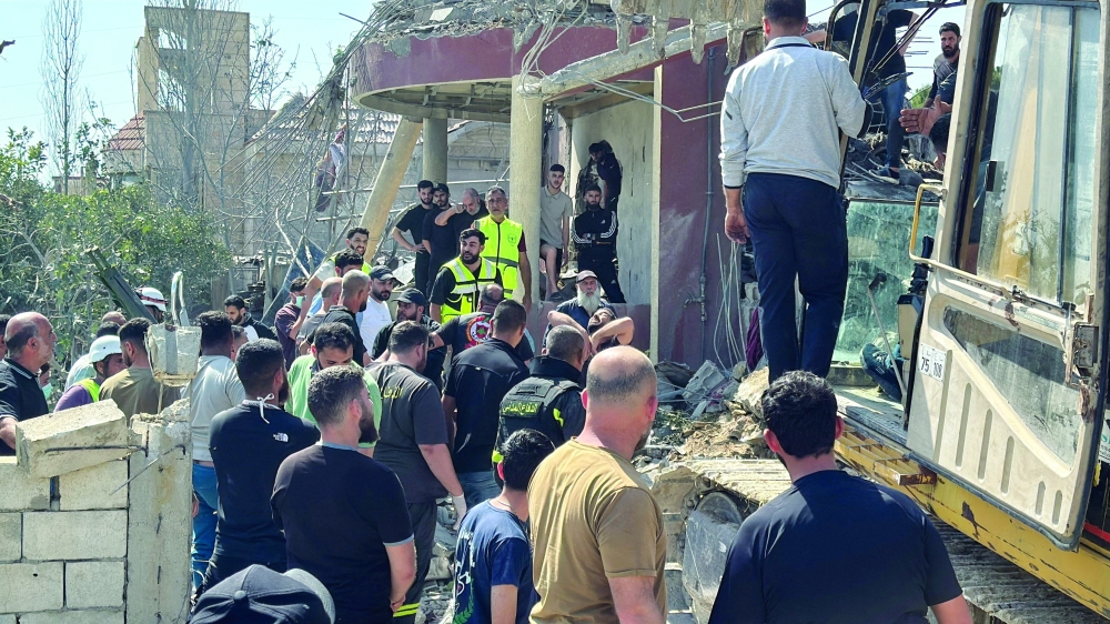 Emergency responders inspect the site of an Israeli strike in Saksakiyeh, Lebanon. — Reuters