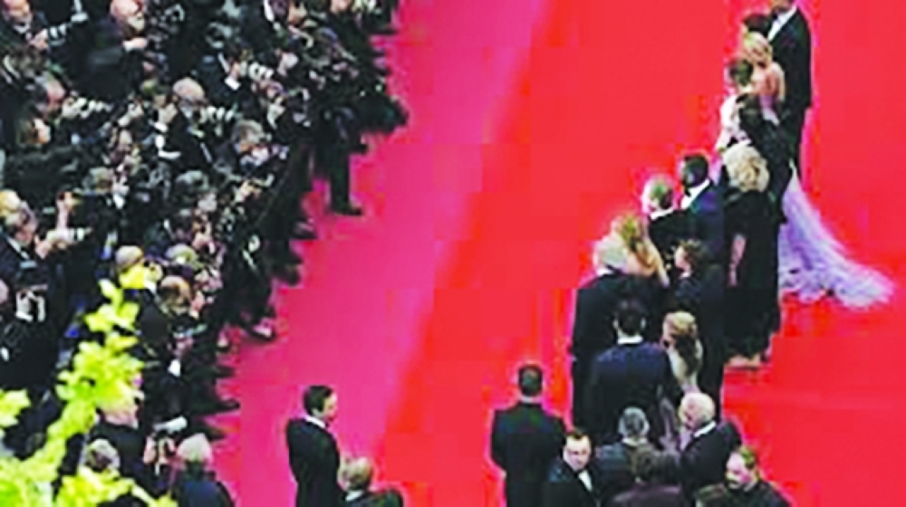 John Travolta is expected to present his directorial debut, “Propeller One-Way Night Coach”. — AFP