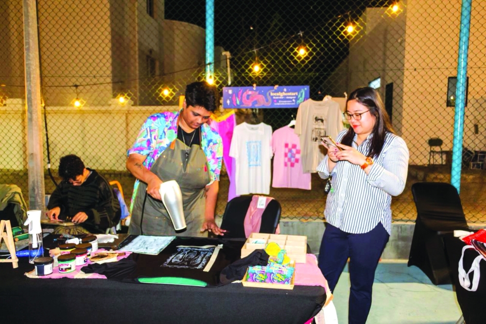 Omani-based illustrator and mixed media artist Anoushka Narayanan during a recent art event in Muscat.