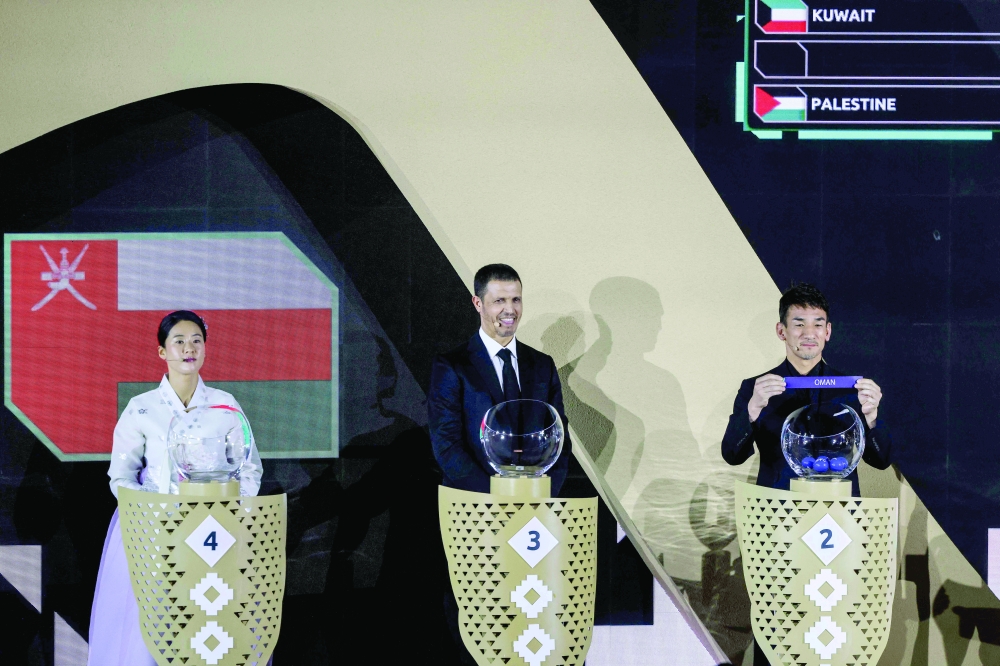 Japanese football icon and two-time AFC Asian Player of the Year Hidetoshi Nakata shows the paper slip of Oman during the final draw of the 2027 AFC Asian Cup 