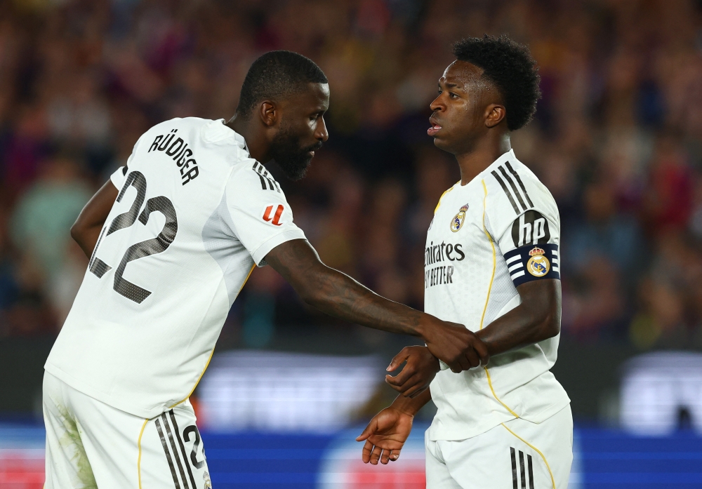  
Real Madrid's Antonio Rudiger and Vinicius Junior  