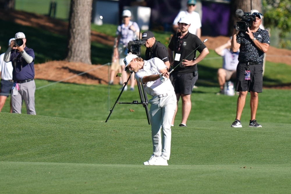  Kristoffer Reitan hits an approach shot on the eighteenth hole during the final round of the Truist Championship golf tournament