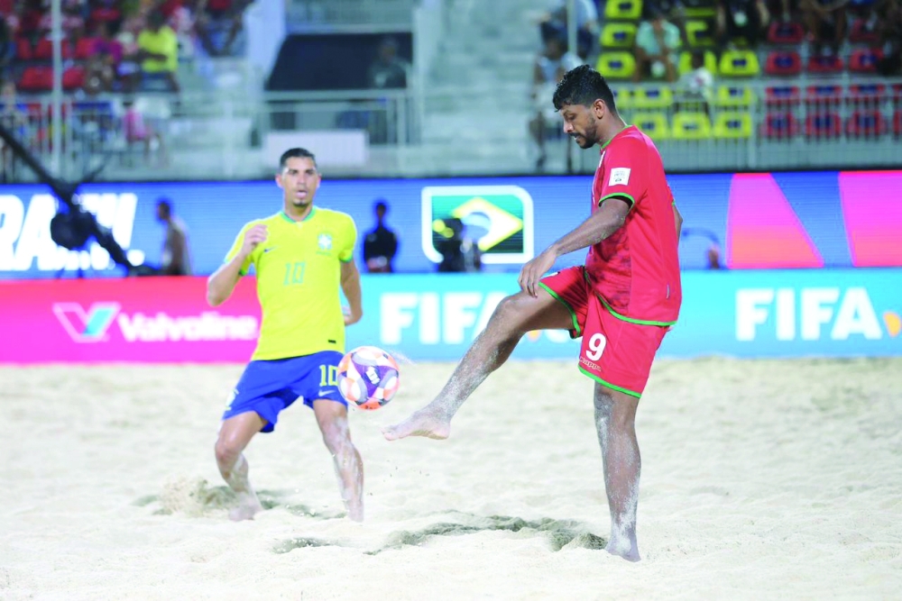 An action shot by Sami al Balushi before shooting at a Brazilian national team player.